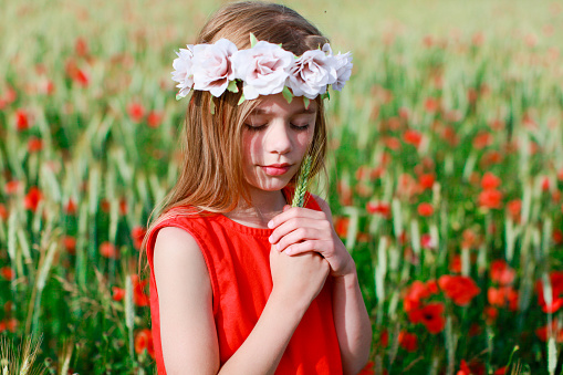 Pretty little girl in nature in spring