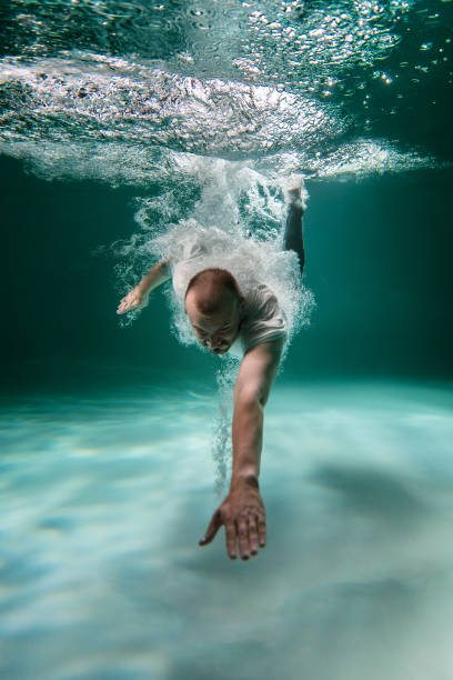 istock The Man in the Deep under the Water. Copy Space 1279839665