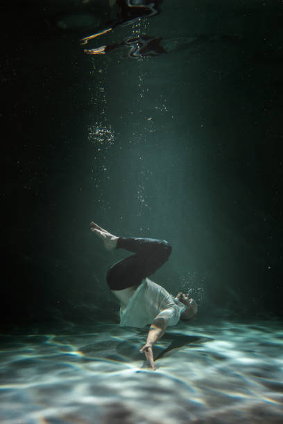 istock The Man in the Deep under the Water. Copy Space 1279839713
