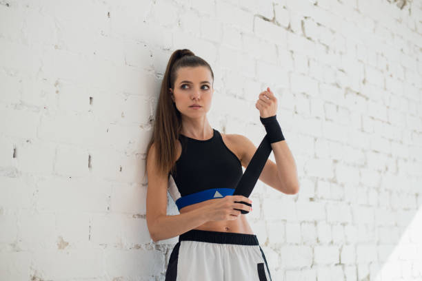 istock A young strong girl mixed martial arts fighter is preparing for sparring 1279840139