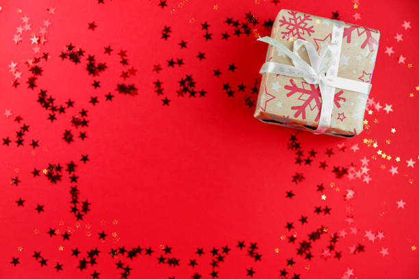 istock Red background with christmas items and glitter stars 1279841106