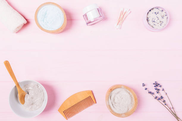 istock Clay face mask and natural cosmetics on pink table 1279841272
