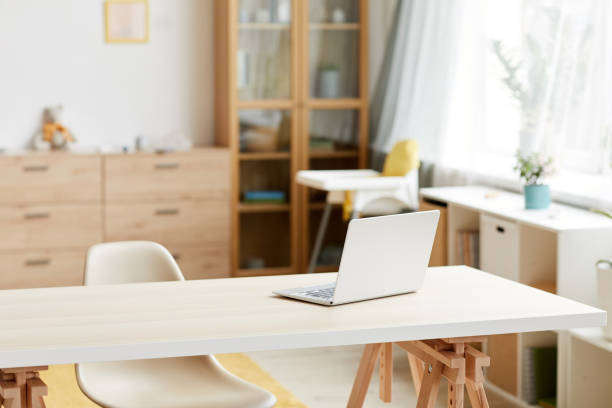 istock Workplace with laptop at home 1279843909