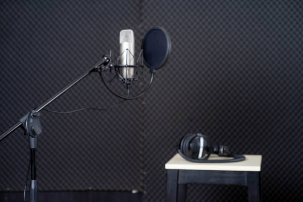 istock young attractive Asian woman musician singer in recoding studio with microphone. Performance arts concept. 1279844097
