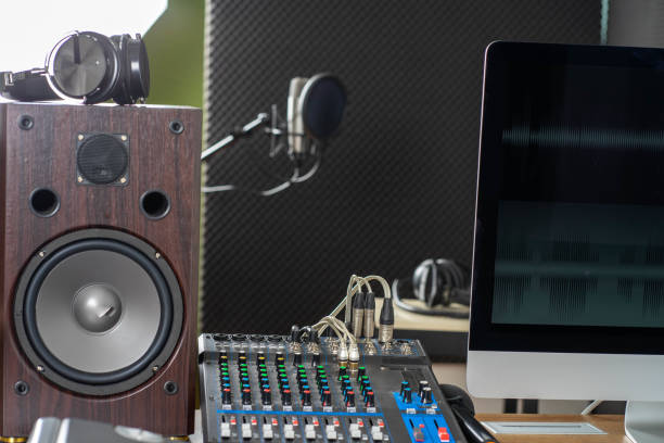 istock young attractive Asian woman musician singer in recoding studio with microphone. Performance arts concept. 1279844120