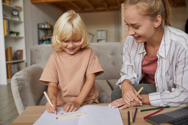 istock Mother teaching son to draw 1279845218