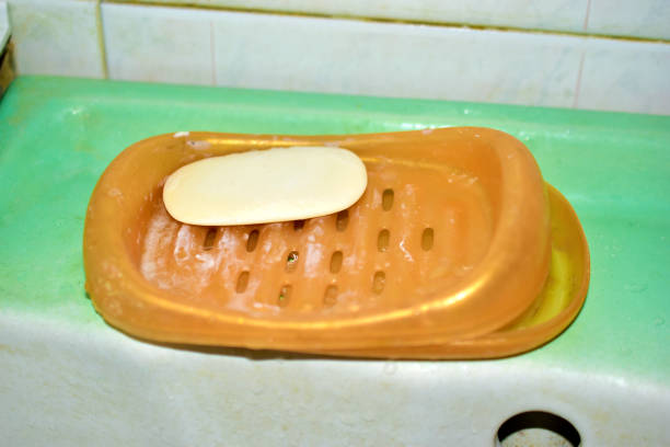 Plastic soap dish with soap in the bathroom