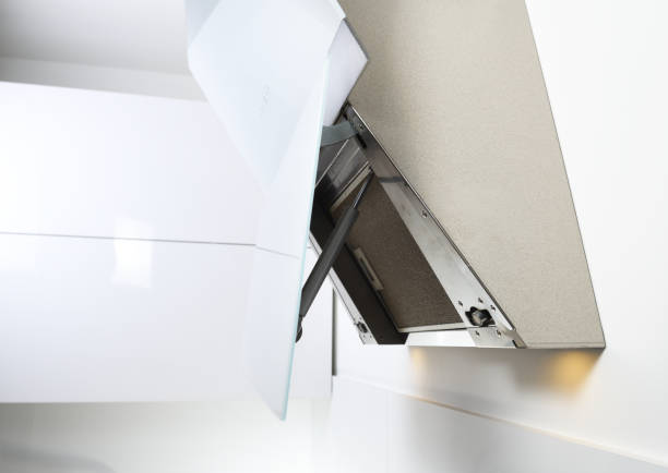 istock White inclined cooker hood. Simple light modern kitchen design.Dirty filter. View from below. 1279847900
