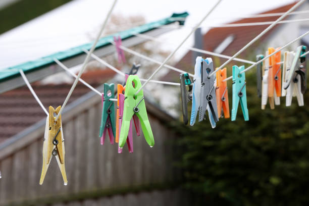 istock Close up of a colored clothespins on a clothesline 1279850465