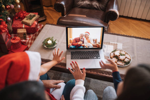 family in christmas video call. - senior adult technology child internet imagens e fotografias de stock