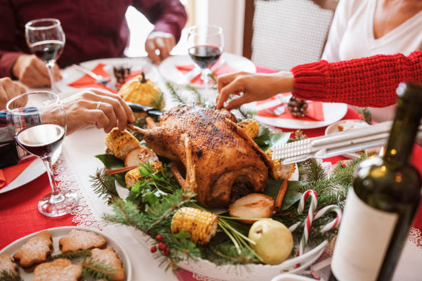 istock Cropped hands cutting and takes meat on dining table. 1279850571