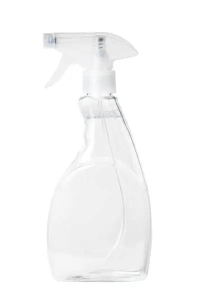Photo of Isolated side view of the clear spray bottle with a clear liquid inside with clipping path.