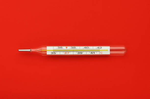Disease and fever. Bunch of blue pills with thermometer. Medical tools.