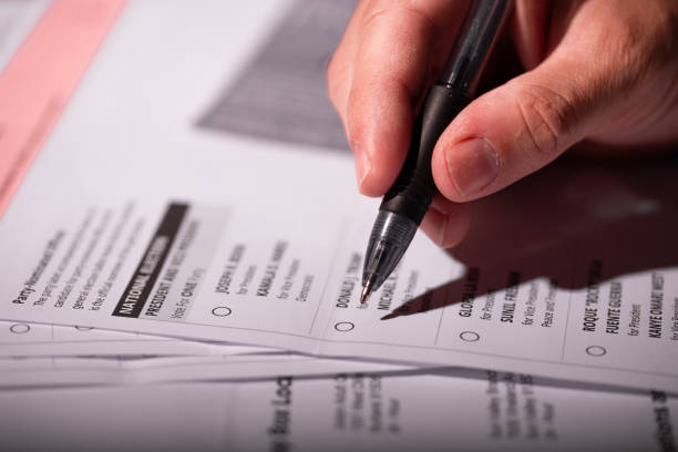 Los Angeles California, October 8, 2020: Voting ballot material. Absentee voting by mail with ballot envelope. Absentee voting is voting-by-mail and allows voters who cannot visit the polls on Election Day, to cast their ballot by the US mail. Filling out a ballot form to vote for an election during 2020