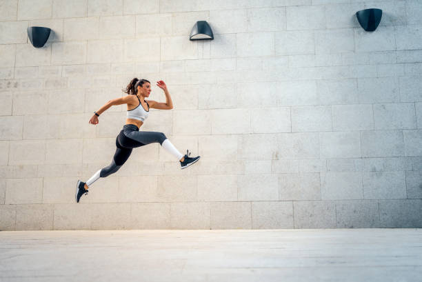 istock Woman athlete jumping during exercising 1279854636