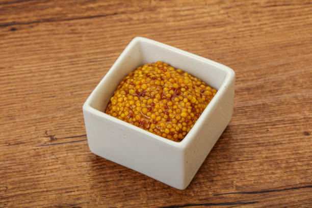 istock Dijon mustard sauce with seeds 1279856544