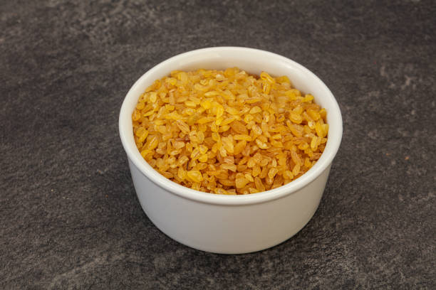 istock Vegetarian cuisine - dry bulgur for cooking 1279856696