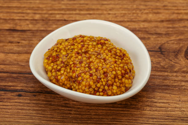 istock Dijon mustard sauce with seeds 1279856891