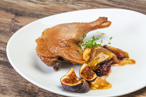 Roasted. duck. leg with plum, fig and apple