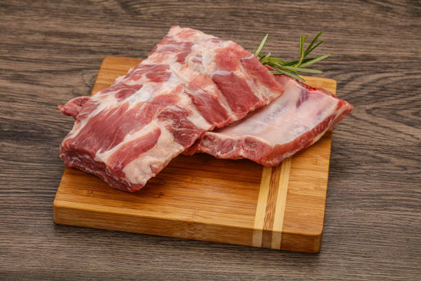 istock Raw pork ribs served rosemary 1279857241