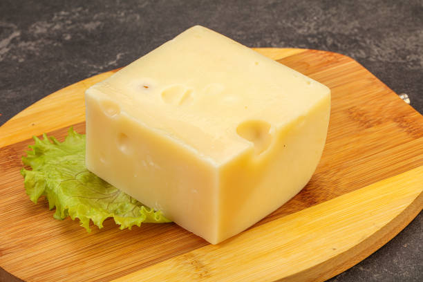 istock Emmental cheese over wooden board 1279857580