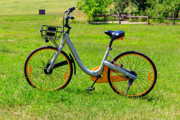 istock Modern bicycle parked on a green lawn in rural area 1279857947