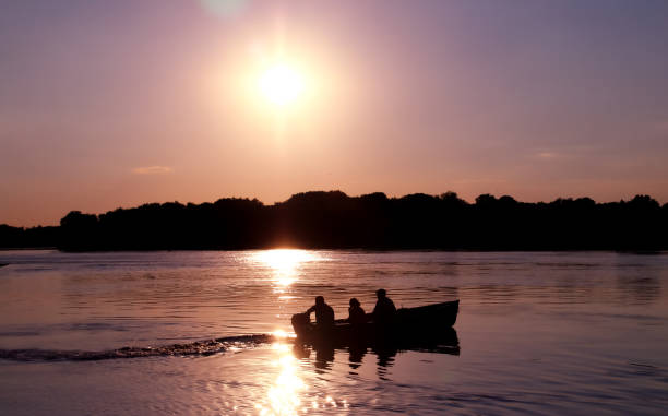 istock The silhouette of a boat navigating the Danube river. 1279858462