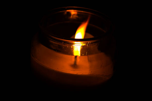 istock Burning candle in the dark. 1279858977