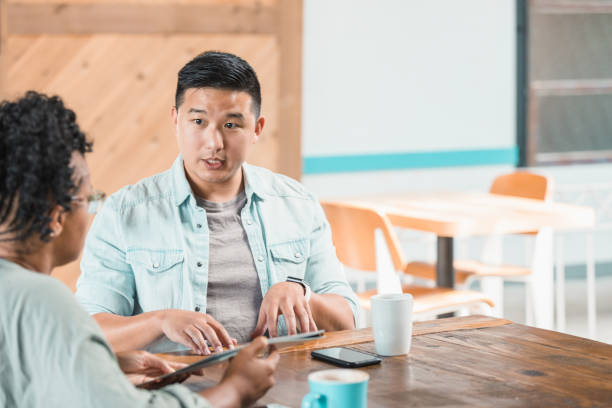 istock Business people participate in brainstorming session 1279859830