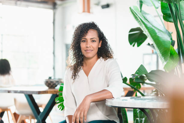 istock Confident woman in trendy cafe 1279859971
