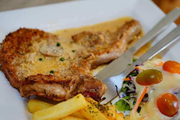 istock Pork Chop with Steak on plate 1279860302