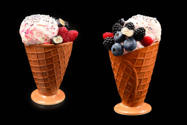 istock Ice cream with blueberries, blackberries and raspberries on a black background.  Copy space. 1279861710