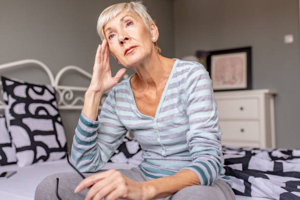 istock Senior woman at home suffering from depression 1279864068