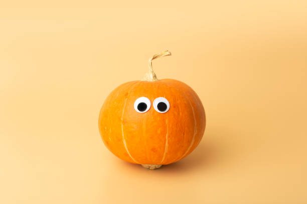 istock Pumpkin minimal concept. Autumn pumpkin on an empty colored background. Thanksgiving and halloween concept 1279867922