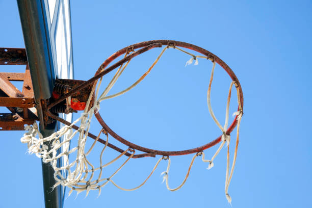 istock Neglected basketball backboard with rusty hoop 1279870158