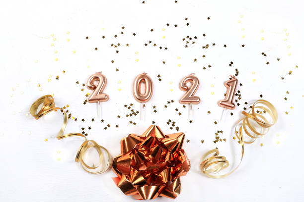 istock Happy new year 2021. Christmas decorations, greeting cards, display banner, product customization for holiday advertising, creative background with gift ribbons, numbers and bows, flat lay, 1279871697