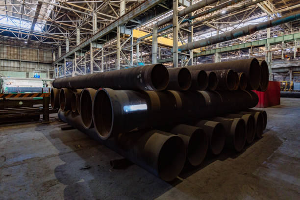 istock New cast iron pipes for pipeline construction in warehouse 1279872829