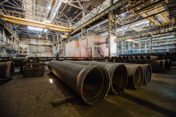 istock New cast iron pipes for pipeline construction in warehouse 1279872830