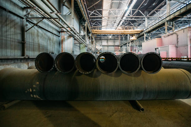 istock New cast iron pipes for pipeline construction in warehouse 1279872835
