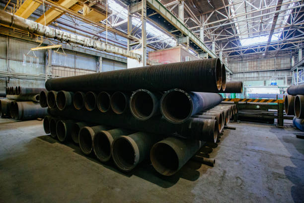 istock New cast iron pipes for pipeline construction in warehouse 1279872836