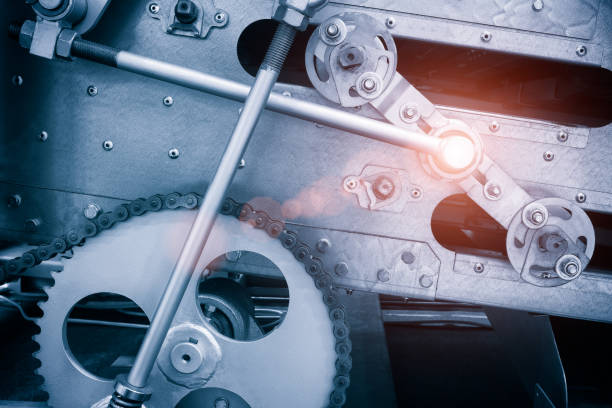 istock Strand roller chain going around  sprockets on industrial machine. industrial engineering  technology concept background 1279872912