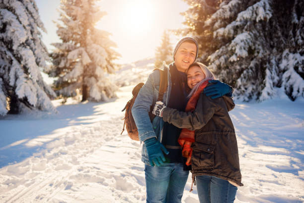 istock Young love couple in a sunny mountain 1279873621