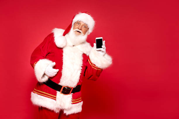 istock Real Santa Claus showing mobile phone screen 1279875935