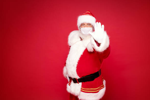 istock Real Santa Claus in white mask posing 1279876140