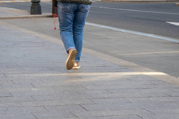 istock Sidewalk. Woman legs walking, motion blur. Selective focus. Copy space. 1279877084