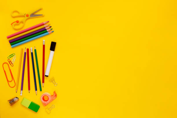 istock School and office supplies on yellow background 1279877231