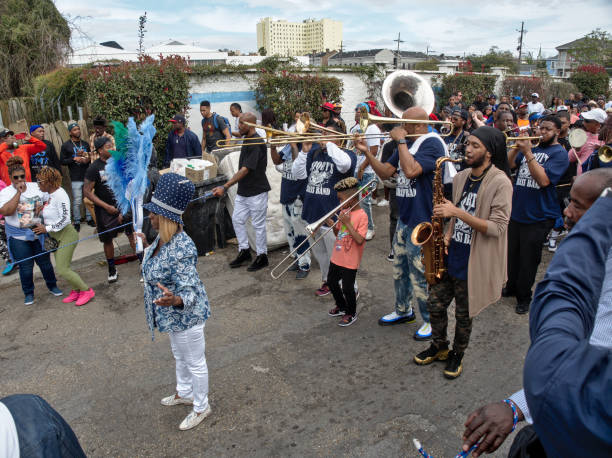 New Orleans Second Line parade New Orleans, Louisiana, USA - 2020: People participate in a Second Line parade, a traditional event of this city. parade photos stock pictures, royalty-free photos & images