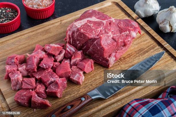 Boneless Beef Chuck Roast Being Cut Into Cubes For Stew Stock Photo - Download Image Now