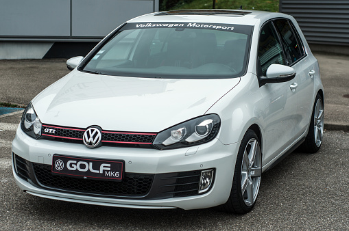 Mulhouse - France - 10 November 2019  -  Front view of white Volkswagen Golf GTI MK6 parked in the street