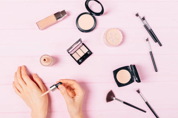 istock Female hands apply sample of foundation on skin 1279887029